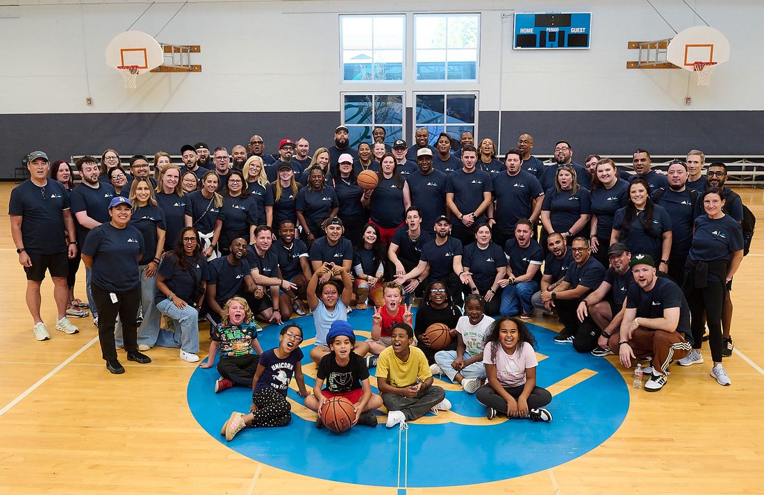 A community gymnasium event with young people in the foreground
